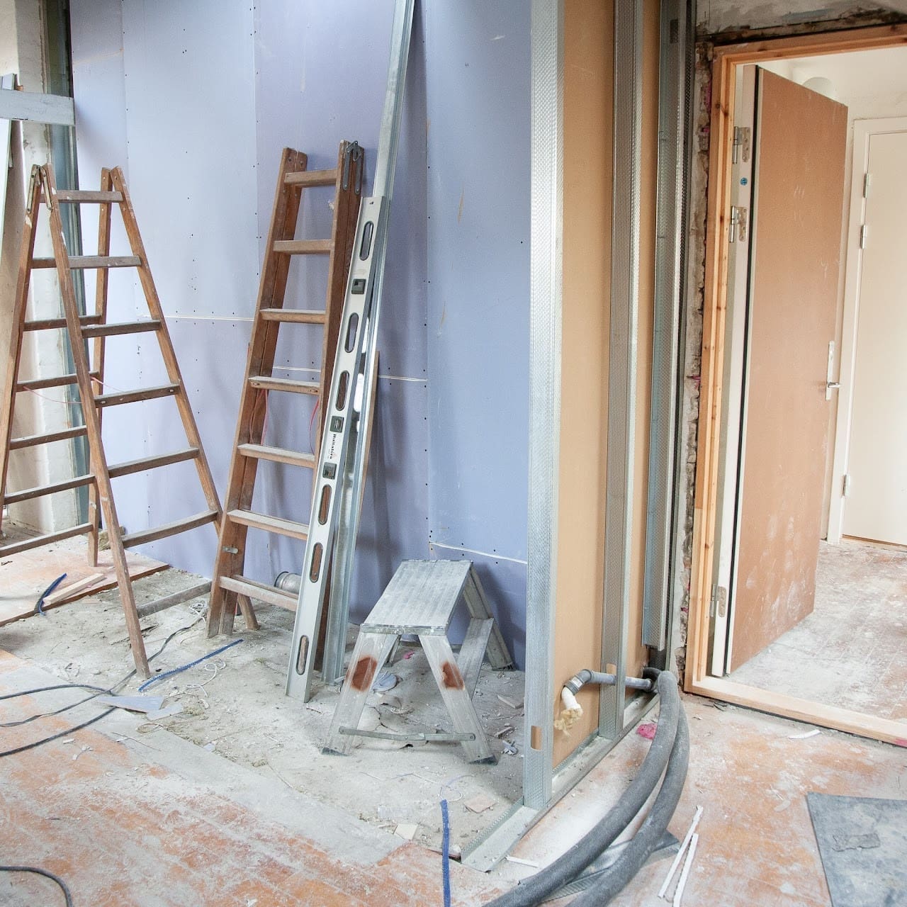 Renovations with ladders and bare walls